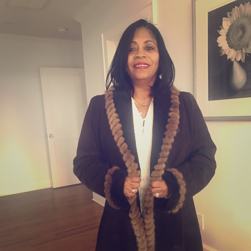Blue Duck woman’s shearling with mink trim.